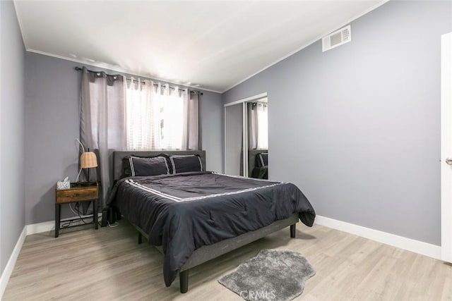7700 Goodland Ave, North Hollywood, CA 91605 - bedroom featuring crown molding, baseboards, light wood-type flooring, and vaulted ceiling