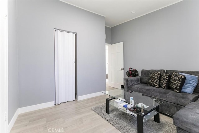 7700 Goodland Ave, North Hollywood, CA 91605 - living area with light wood-style flooring, crown molding, and baseboards
