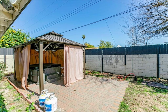7700 Goodland Ave, North Hollywood, CA 91605 - view of patio / terrace featuring a covered hot tub, a gazebo, and a fenced backyard
