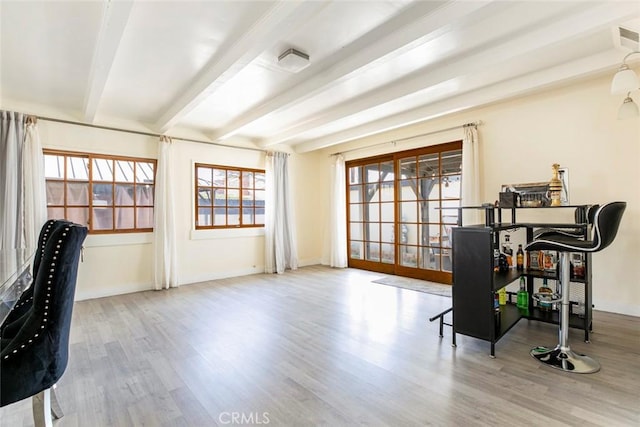 7700 Goodland Ave, North Hollywood, CA 91605 - home office featuring beamed ceiling, wood finished floors, and baseboards