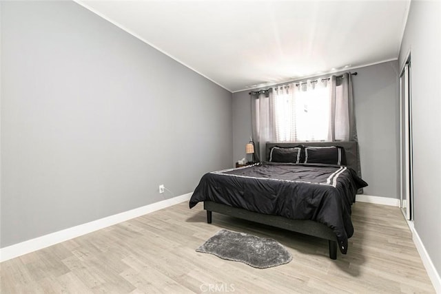 7700 Goodland Ave, North Hollywood, CA 91605 - bedroom featuring ornamental molding, light wood-style floors, and baseboards