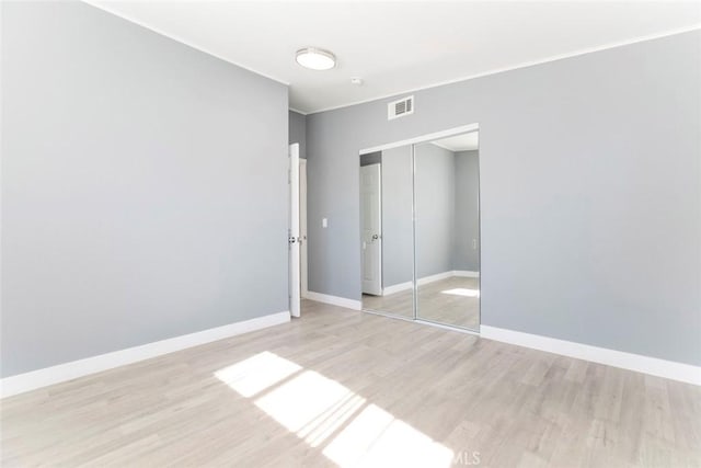 7700 Goodland Ave, North Hollywood, CA 91605 - unfurnished bedroom featuring light wood-type flooring, a closet, and baseboards