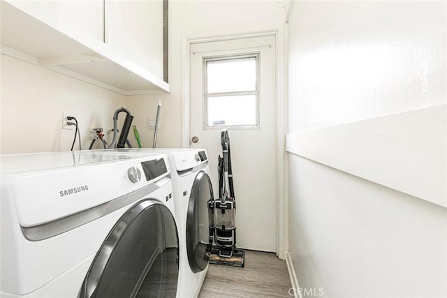 7700 Goodland Ave, North Hollywood, CA 91605 - laundry room with independent washer and dryer, light wood-type flooring, and baseboards