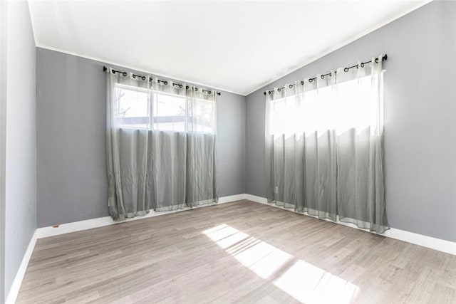7700 Goodland Ave, North Hollywood, CA 91605 - spare room with baseboards, wood finished floors, and crown molding