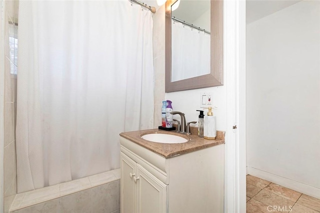 7700 Goodland Ave, North Hollywood, CA 91605 - full bathroom with vanity, tile patterned floors, and curtained shower