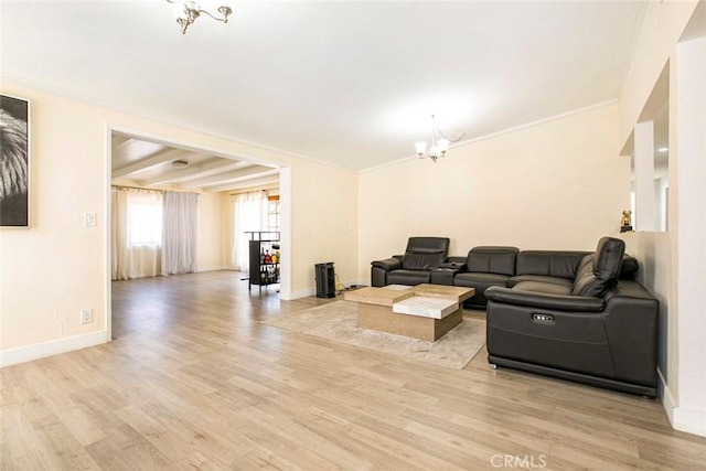 7700 Goodland Ave, North Hollywood, CA 91605 - living area with light wood-type flooring, a chandelier, baseboards, and crown molding
