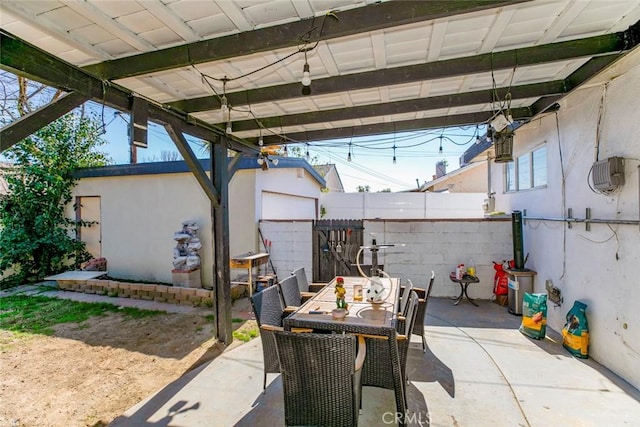 7700 Goodland Ave, North Hollywood, CA 91605 - view of patio featuring outdoor dining space and fence