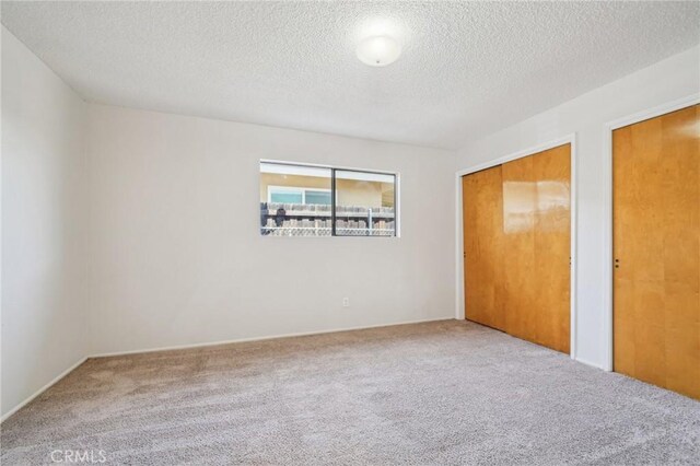 40389 Melrose Ave, Hemet, CA 92544 - unfurnished bedroom with carpet floors and a textured ceiling