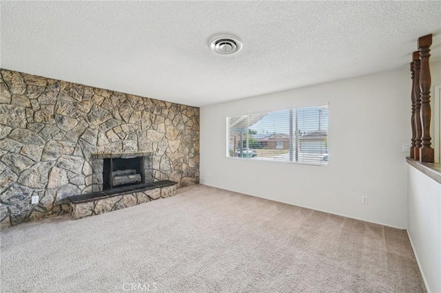 40389 Melrose Ave, Hemet, CA 92544 - unfurnished living room featuring carpet flooring, a stone fireplace, and a textured ceiling