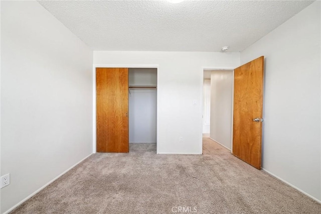 40389 Melrose Ave, Hemet, CA 92544 - unfurnished bedroom featuring carpet, a closet, and a textured ceiling