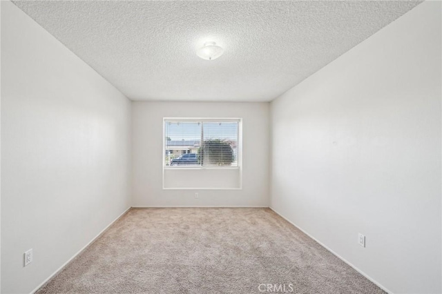 40389 Melrose Ave, Hemet, CA 92544 - unfurnished room featuring carpet flooring, a textured ceiling, and baseboards
