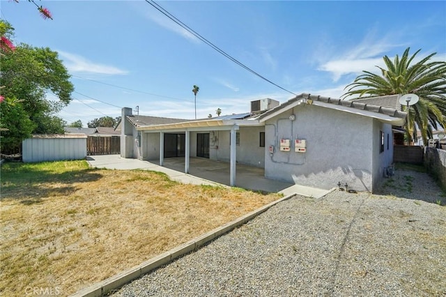 40389 Melrose Ave, Hemet, CA 92544 - back of property with a patio area, stucco siding, an outdoor structure, central AC, and a storage shed