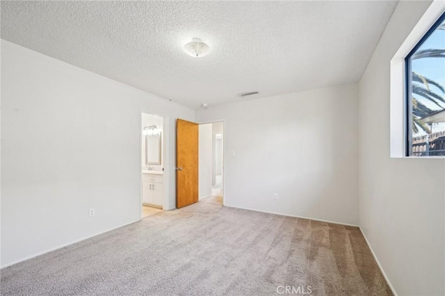 40389 Melrose Ave, Hemet, CA 92544 - empty room featuring light colored carpet and a textured ceiling