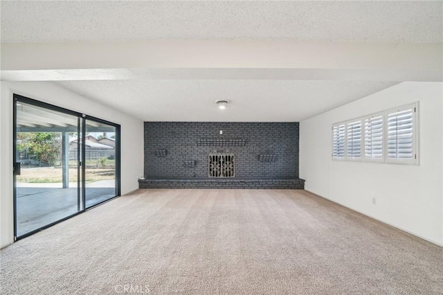 40389 Melrose Ave, Hemet, CA 92544 - unfurnished living room with carpet floors, a brick fireplace, and a textured ceiling