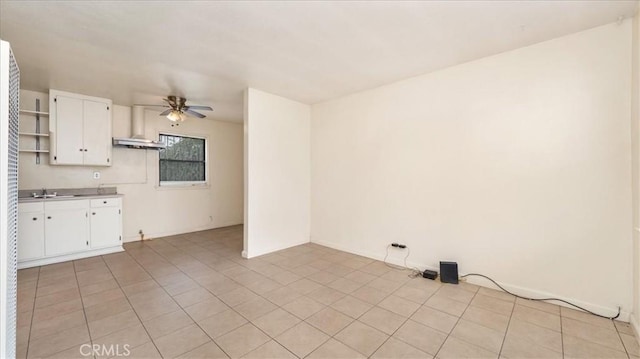 15820 E Queenside Dr, Covina, CA 91722 - spare room with ceiling fan, light tile patterned floors, a sink, and baseboards