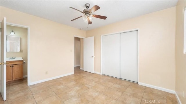 15820 E Queenside Dr, Covina, CA 91722 - unfurnished bedroom featuring a closet, ensuite bathroom, a sink, and baseboards