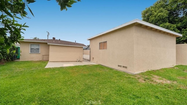 15820 E Queenside Dr, Covina, CA 91722 - rear view of house featuring stucco siding and a patio