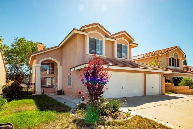 mediterranean / spanish-style house featuring concrete driveway, stucco siding, a chimney, an attached garage, and a tiled roof