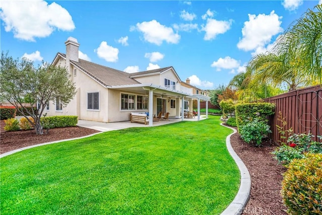 45133 Fieldbrook Ct, Temecula, CA 92592 - back of house with a chimney, a patio, and stucco siding