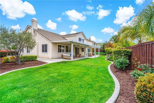 45133 Fieldbrook Ct, Temecula, CA 92592 - back of property with a chimney, a patio, and stucco siding