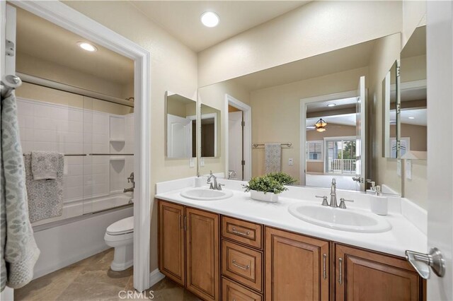 45133 Fieldbrook Ct, Temecula, CA 92592 - bathroom featuring double vanity, a ceiling fan, toilet, and tub / shower combination