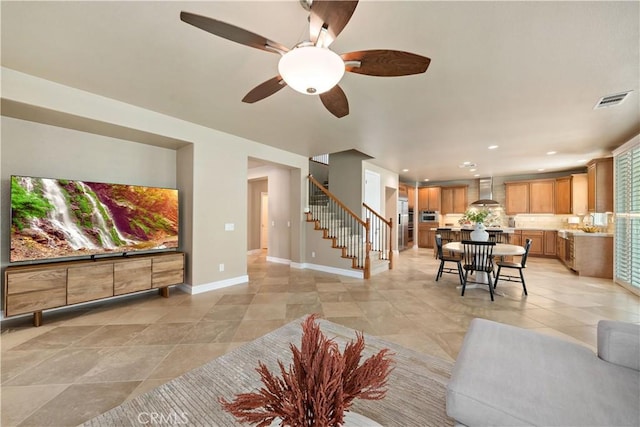 45133 Fieldbrook Ct, Temecula, CA 92592 - living area featuring stairway, a ceiling fan, recessed lighting, light tile patterned floors, and baseboards