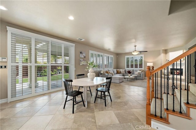 45133 Fieldbrook Ct, Temecula, CA 92592 - dining space featuring stairway, a ceiling fan, baseboards, recessed lighting, and light tile patterned flooring