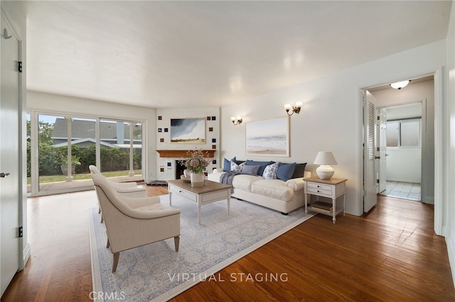 15408 Mottley Dr, La Mirada, CA 90638 - living area with wood finished floors and a fireplace
