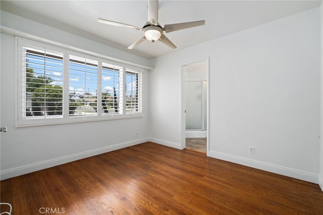 15408 Mottley Dr, La Mirada, CA 90638 - unfurnished room with baseboards, dark wood-style flooring, and a ceiling fan