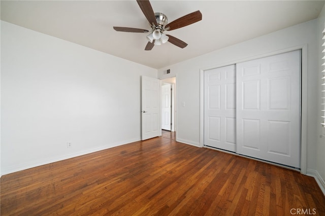 15408 Mottley Dr, La Mirada, CA 90638 - unfurnished bedroom featuring dark wood-style floors, baseboards, a closet, and a ceiling fan