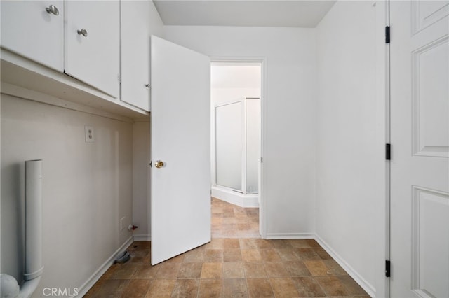 15408 Mottley Dr, La Mirada, CA 90638 - laundry room with stone finish floors and baseboards