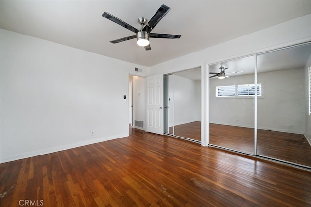 15408 Mottley Dr, La Mirada, CA 90638 - unfurnished bedroom with multiple closets, wood finished floors, baseboards, and ceiling fan