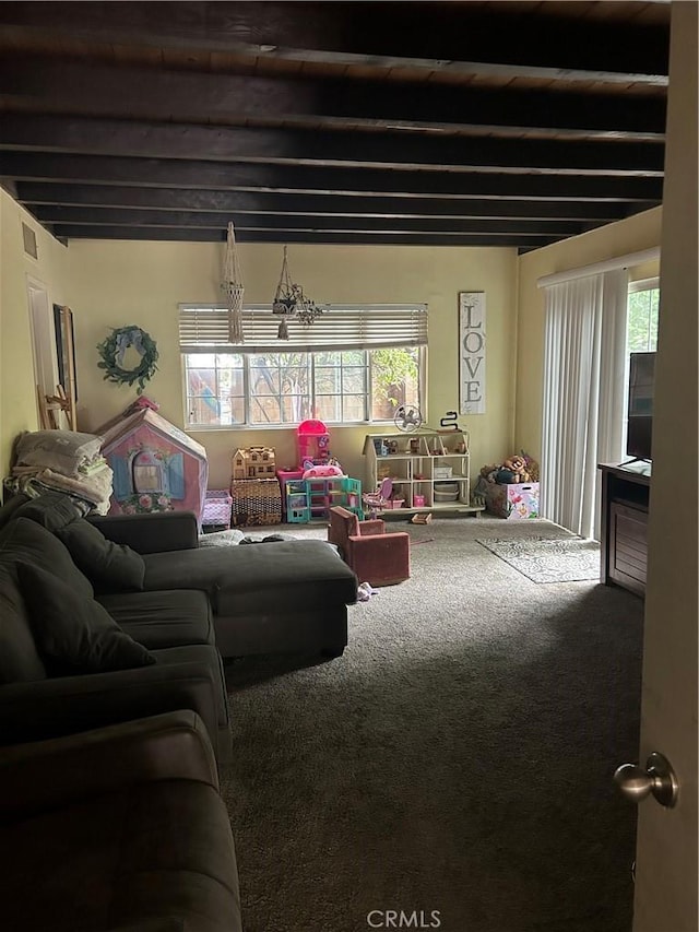8900 Geyser Ave, Northridge, CA 91324 - living room featuring carpet, plenty of natural light, and beamed ceiling