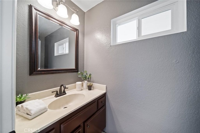 11396 Burl Dr, Fontana, CA 92337 - bathroom with vanity and a textured wall