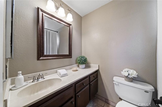 11396 Burl Dr, Fontana, CA 92337 - bathroom featuring toilet, vanity, and tile patterned flooring