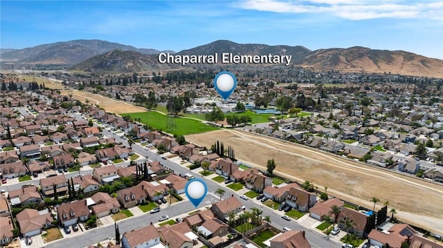 11396 Burl Dr, Fontana, CA 92337 - aerial overview of property's location featuring a mountain backdrop and nearby suburban area