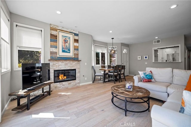 29386 Via Napoli, Laguna Niguel, CA 92677 - living room with light wood-type flooring, baseboards, recessed lighting, and a fireplace