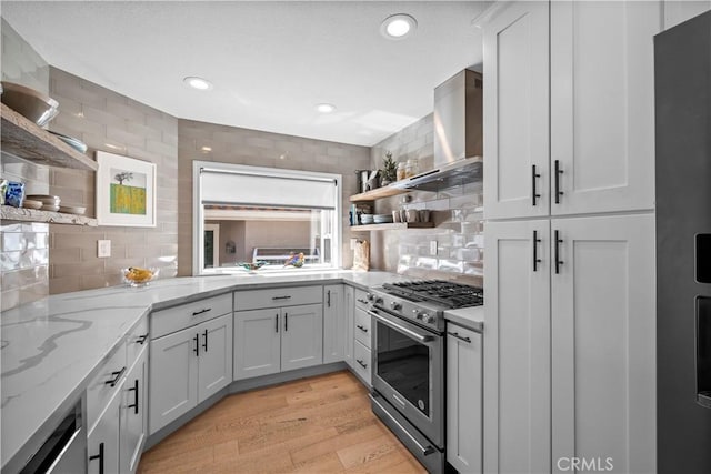 29386 Via Napoli, Laguna Niguel, CA 92677 - kitchen featuring open shelves, high end stainless steel range oven, wall chimney exhaust hood, tasteful backsplash, and light wood-type flooring