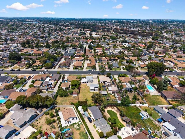aerial view of property's location featuring nearby suburban area