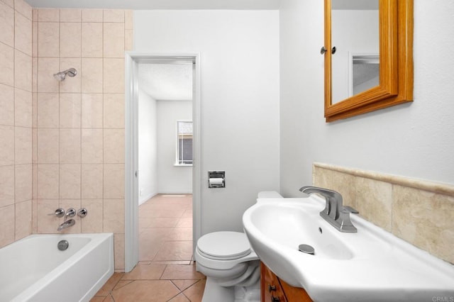 full bathroom featuring tile patterned floors, vanity, toilet, and shower / tub combination