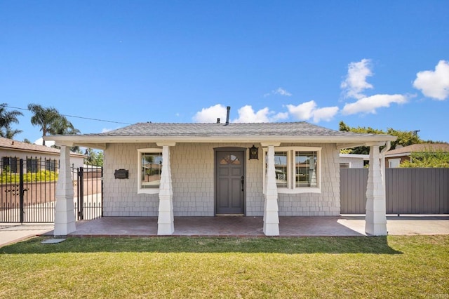 bungalow-style home with a porch and roof with shingles