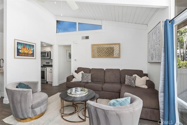 33926 La Serena Dr Unit 7, Dana Point, CA 92629 - living area featuring lofted ceiling, dark wood-style floors, wooden ceiling, and baseboards