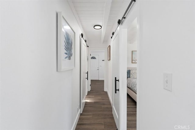 33926 La Serena Dr Unit 7, Dana Point, CA 92629 - corridor featuring a barn door, dark wood-style flooring, beam ceiling, and baseboards