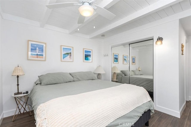 33926 La Serena Dr Unit 7, Dana Point, CA 92629 - bedroom featuring baseboards, dark wood-style flooring, a closet, a ceiling fan, and wooden ceiling with exposed beams