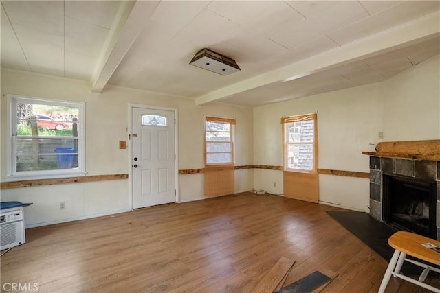 29219 Lyon Dr, Cedar Glen, CA 92321 - entryway with beamed ceiling, wood finished floors, and a tile fireplace