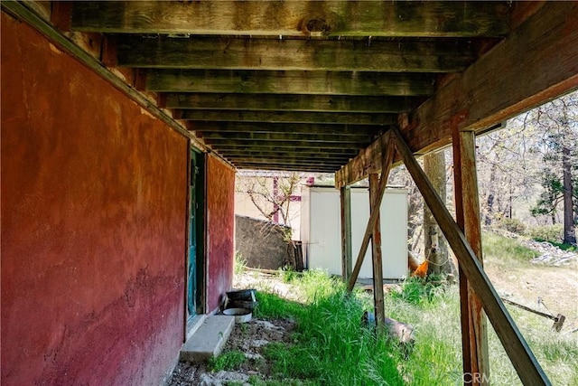 29219 Lyon Dr, Cedar Glen, CA 92321 - view of patio with a storage unit and an outdoor structure