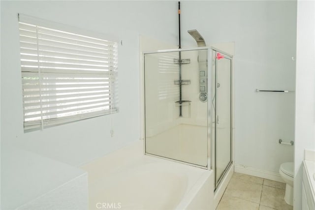 7404 Marshall Ct, Highland, CA 92346 - bathroom featuring a stall shower, a garden tub, tile patterned floors, toilet, and baseboards