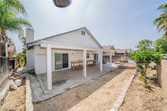 7404 Marshall Ct, Highland, CA 92346 - back of property with a patio area, a fenced backyard, cooling unit, and a tiled roof
