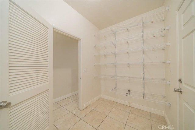 7404 Marshall Ct, Highland, CA 92346 - spacious closet with light tile patterned flooring