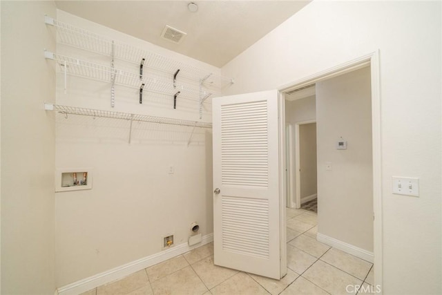 7404 Marshall Ct, Highland, CA 92346 - laundry room with electric dryer hookup, washer hookup, and light tile patterned flooring